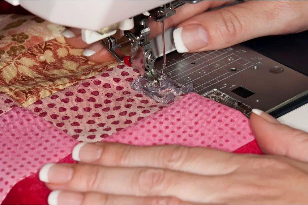 close up view of hand doing sewing