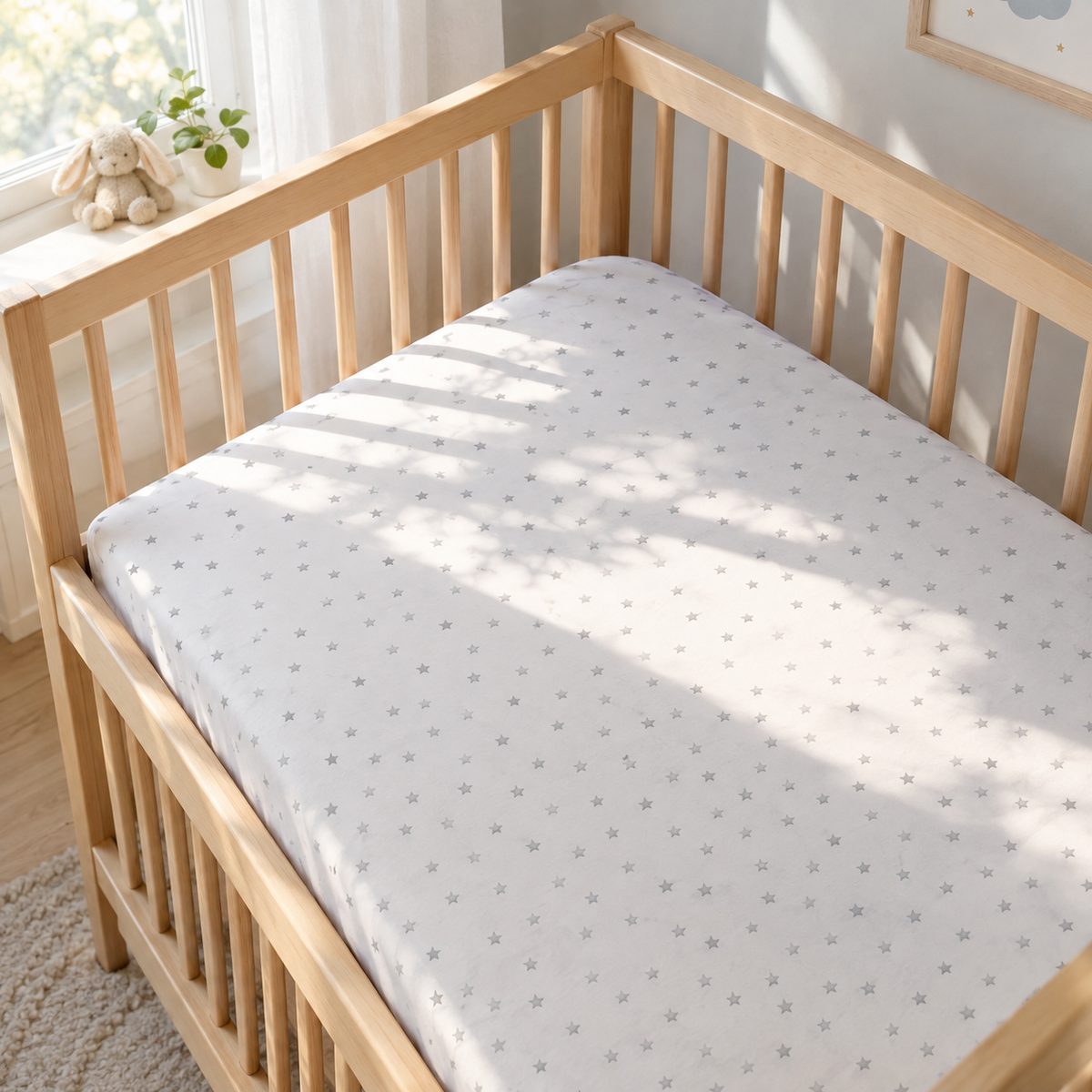 Snug fitted crib sheet on a crib mattress