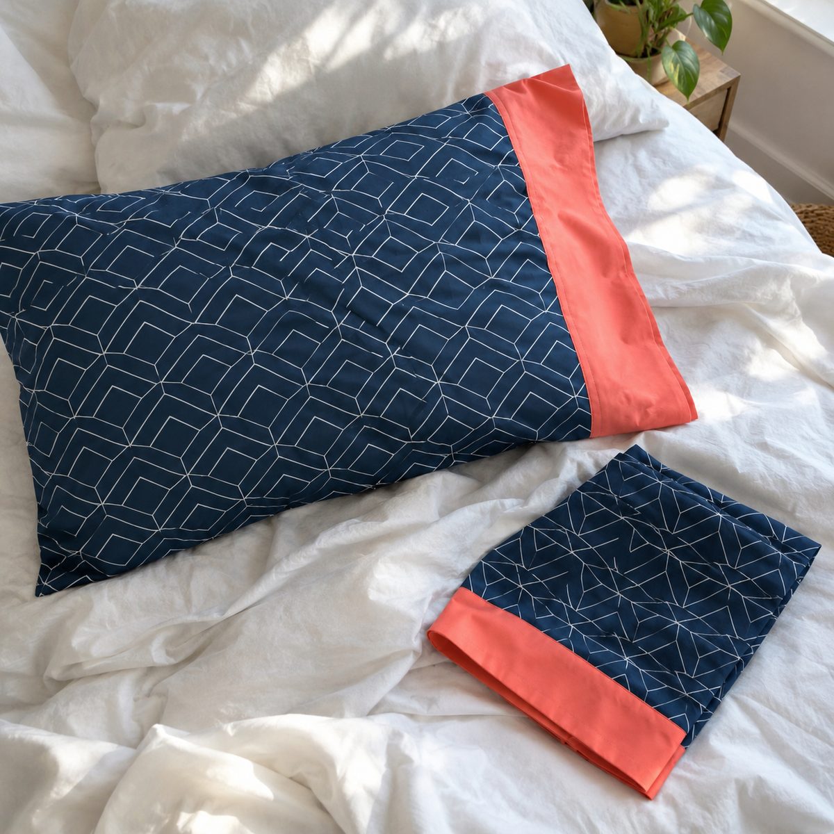 Handmade pillowcase with contrast cuff on a bed