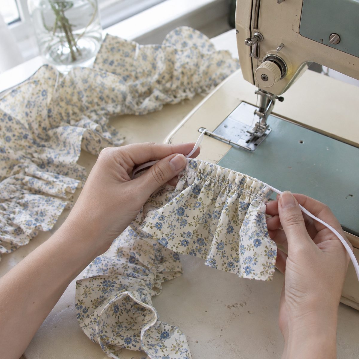 Gathering a cotton ruffle over dental floss stitched with a zigzag